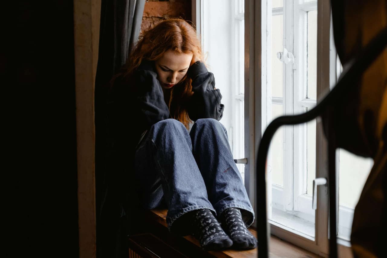 woman hurting at her apartment